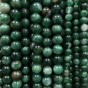 Fuchsite / Mica vert, perles rondes de 6 ou 8 mm. Vendu en fil de perle 38/39 cm, en bracelet de 17 à 21cm, en collier de 45 ou sautoir de 60cm. Qualité AA à AAA, superbes perles !