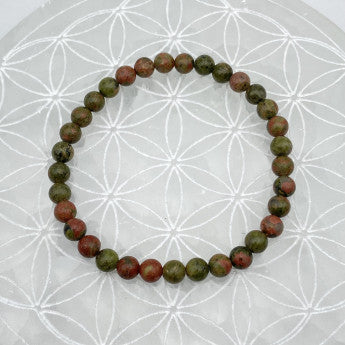 Jaspe Unakite, perles rondes de 6 ou 8 mm. Vendu en fil de perle 38/39 cm, en bracelet de 17 à 21cm, en collier de 45 ou sautoir de 60cm. Qualité AA à AAA, superbes perles, un jaspe unique !