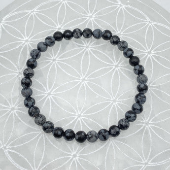 Obsidienne Flocon de Neige / Mouchetée, perles rondes de 6 ou 8 mm. Vendu en fil de perle 38/39 cm, en bracelet de 17 à 21cm, en collier de 45 ou sautoir de 60cm. Qualité AA à AAA, superbes perles !