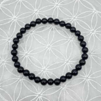 Onyx finition Mat, perles rondes de 6 ou 8 mm. Vendu en fil de perle 38/39 cm, en bracelet de 17 à 21cm, en collier de 45 ou sautoir de 60cm. Qualité AA à AAA, superbes perles à l'effet calmant !