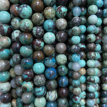 Chrysocolle, perles rondes de 6 et 8 mm, vendu en : fil de perle 38/39 cm, en bracelet de 17 à 21cm, en collier de 45 ou sautoir de 60cm. Qualité AA à AAA, superbes perles souvent prises pour de la turquoise !