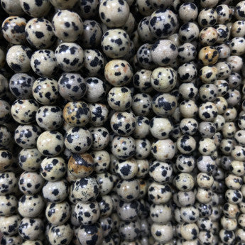 Jaspe dalmatien! perles rondes de 4, 6, 8 ou 10 mm. Vendu en fil de perle 38/39 cm, en bracelet de 17 à 21cm, en collier de 45 ou sautoir de 60cm. Qualité AA à AAA, superbes perles bicolores !