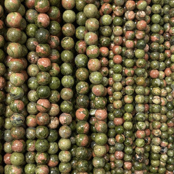 Jaspe Unakite, perles rondes de 6 ou 8 mm. Vendu en fil de perle 38/39 cm, en bracelet de 17 à 21cm, en collier de 45 ou sautoir de 60cm. Qualité AA à AAA, superbes perles, un jaspe unique !