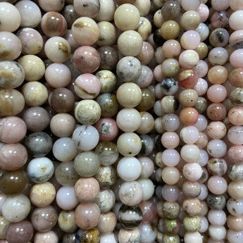 Opale Rose des Andes, perles rondes de 6 ou 8 mm. Vendu en fil de perle 38/39 cm, en bracelet de 17 à 21cm, en collier de 45 ou sautoir de 60cm. Qualité AA à AAA, superbes perles !